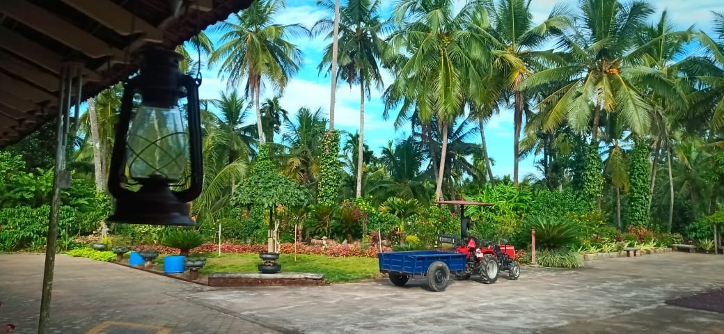 Open estate grounds at Sriniketana Homestay, ideal for camps and retreats